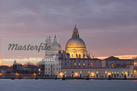 View of church of Santa Maria della Salute from San Giorgio Maggiore island at dusk, Venice, Veneto, Italy