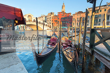 Two traditional venetian gondolas in front of Rialto Bridge, Canal Grande, Venice, Veneto, Italy