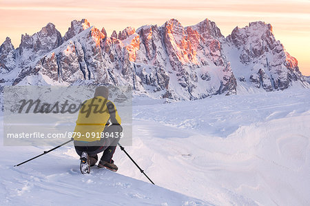 A photographer in action on the top of Col Margherita, Dolomites, Falcade, Belluno province, Veneto, Italy