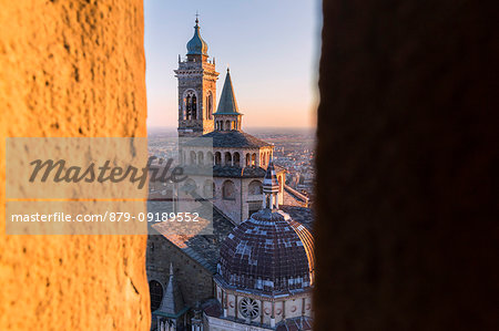 Basilica of Santa Maria Maggiore from a breach in the Civic Tower during sunset. Bergamo(Upper town), Lombardy, Italy.