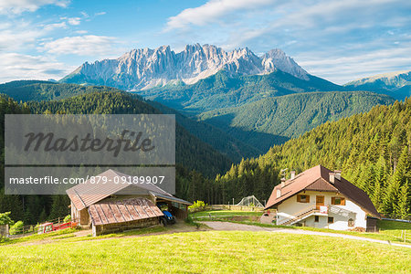 The alpine cottages of Kropfhof with the view of Latemr, Val d'Ega / Eggental, Dolomites, Province of Bolzano, South Tyrol, italian alps, Italy