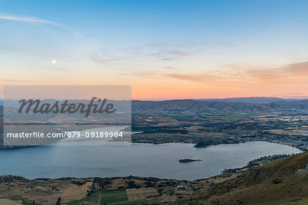 Moonlight over Lake Wanaka at sunset. Wanaka, Queenstown Lakes district, Otago region, South Island, New Zealand.