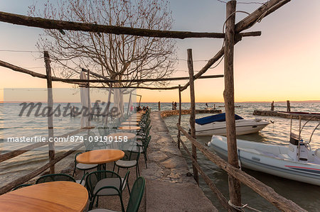 The lakefront restaurant of Punta San Vigilio on the eastern shore of Lake Garda, Verona province, Veneto, Italy.