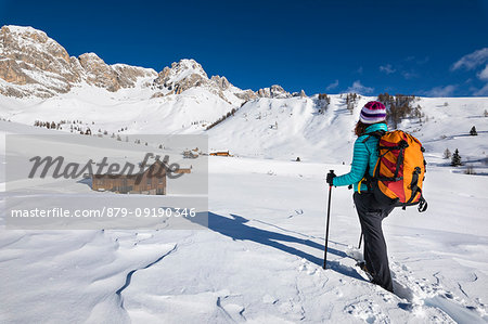A girl is looking at Fuciace, a small village in Dolomites near San Pellegrino Pass (Soraga di Fassa, Biois Valley, Trento province, Trentino-Alto Adige, Italy, Europe) (MR) A girl is looking at Fuciace, a small village in Dolomites near San Pellegrino Pass (Soraga di Fassa, Biois Valley, Trento province, Trentino-Alto Adige, Italy, Europe) (MR)