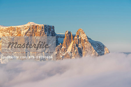 Alpe di Siusi/Seiser Alm, Dolomites, South Tyrol, Italy. The peaks of Sciliar/Schlern in the light of the sunrise