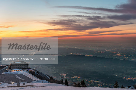 Monte Grappa, province of Vicenza, Veneto, Italy, Europe. The refuge Bassano. The sun rises above the Venetian Plain