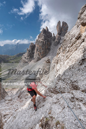 Cristallino di Misurina, Misurina, Dolomites, province of Belluno, Veneto, Italy. A climber in the ascent to the Cristallino di Misurina