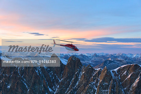 Aerial view of helicopter in flight on Pizzi Gemelli toward Piz Bernina, Valmalenco, Lombardy, border of Italy and Switzerland