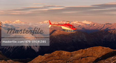 Aerial view of helicopter in flight towards Mount Ortles and Gran Zebrù, Valmalenco, Valtellina, Lombardy, Italy