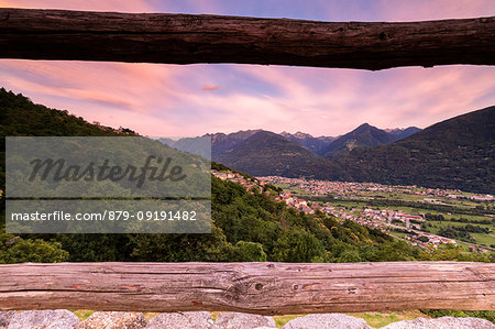 Village of Mello seen from wood fence of Castello di Domofole, Costiera dei Cech, Sondrio province, Valtellina, Lombardy, Italy