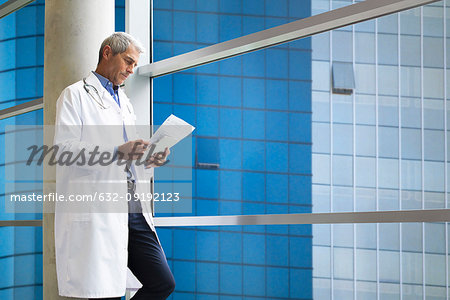 Doctor reading medical reports