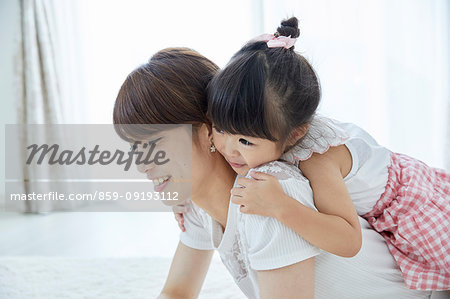 Japanese mother and daughter at home