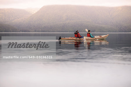 Friends kayaking in lake, Johnstone Strait, Telegraph Cove, Canada