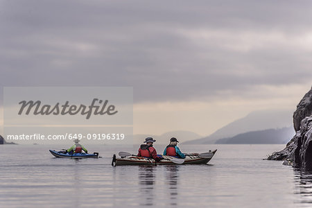 Friends kayaking in lake, Johnstone Strait, Telegraph Cove, Canada