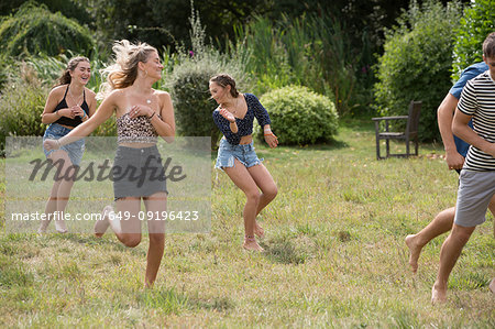 Friends running in park
