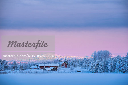 Sunrise on frozen Torassieppi Lake, Lapland, Finland, Europe