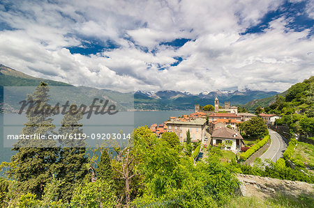 Clouds over the medieval village of Corenno Plinio and Lake Como, Dervio, Lecco province, Lombardy, Italian Lakes, Italy, Europe