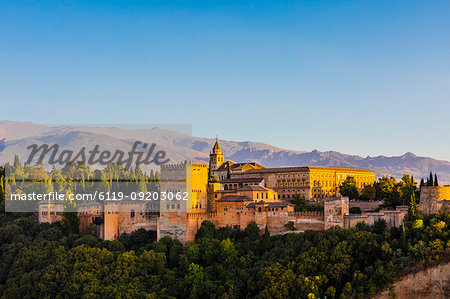 View of Alhambra, UNESCO World Heritage Site, and Sierra Nevada mountains, Granada, Andalucia, Spain, Europe
