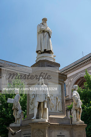 Leonardo da Vinci statue with his disciples at his feet in Piazza della Scala, Milan, Lombardy, Italy, Europe