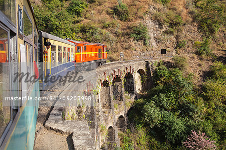 The Himalayan Queen toy train crossing a viaduct, on the Kalka to Shimla Railway, UNESCO World Heritage Site, Northwest India, Asia