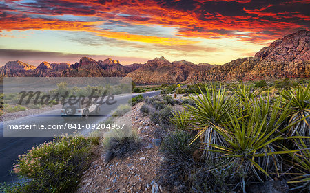 Car driving through The Red Rock Canyon National Recreation Area at sunset, Las Vegas, Nevada, United States of America, North America