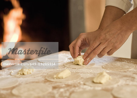 Cook filling pasta dough in kitchen