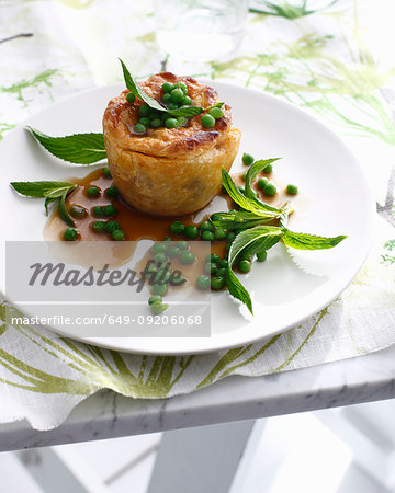 Plate of lamb pie with peas