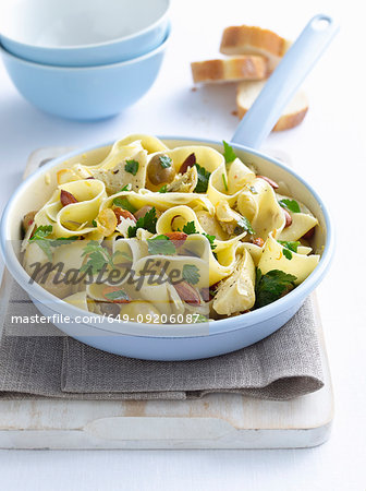Pot of pasta with chicken and olives