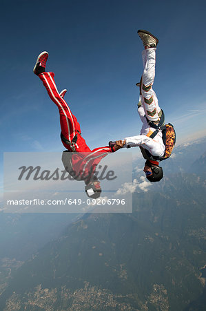 Skydivers freeflying over Locarno, Tessin, Switzerland