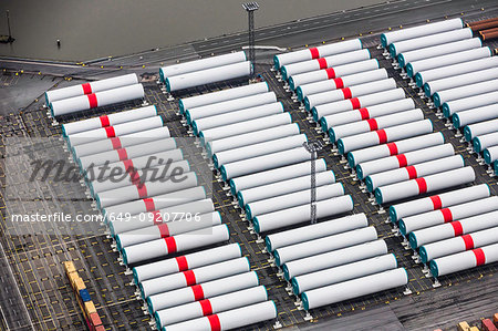 Rows of wind towers, component part for off shore wind turbines,  Bremerhaven, Bremen, Germany