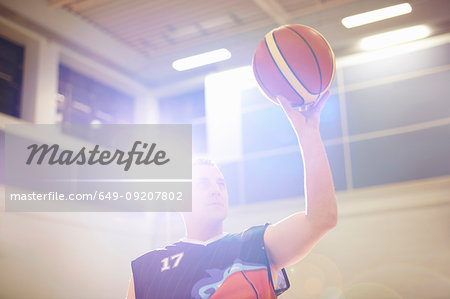 Wheelchair basketball player aiming ball