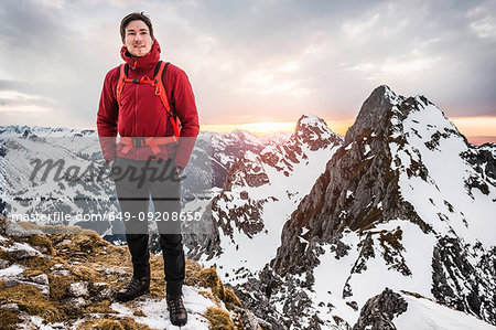 Hiker with hands in pockets, Kellenspitze, Tannheim mountains, Tyrol, Austria