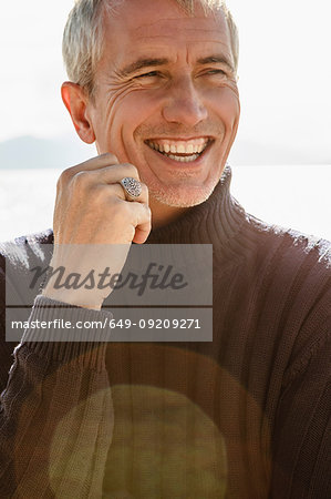 Portrait of mature man, outdoors, smiling