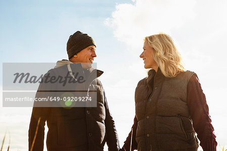 Mature couple, outdoors, face to face, smiling