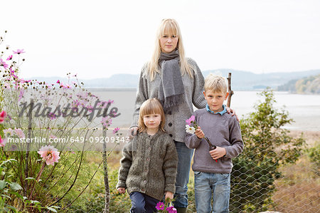 Portrait of mother and children in organic garden, Orust, Sweden