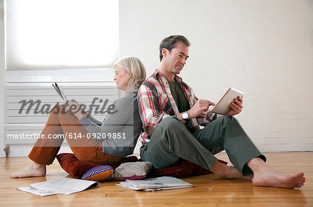 Older couple relaxing on floor