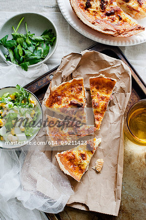 Quiche lorraine with parsley and salad