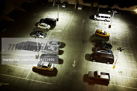 High angle view of cars in parking lot at night