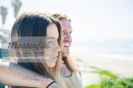 Portrait of  couple, man with arm around woman