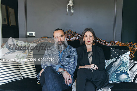 Couple sitting on antique sofa