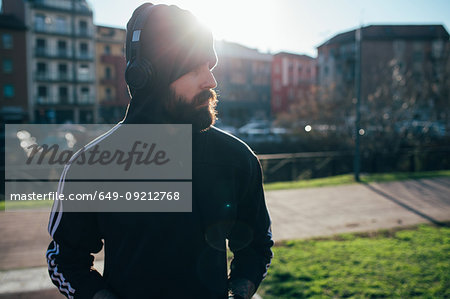 Man wrapped up warmly in park