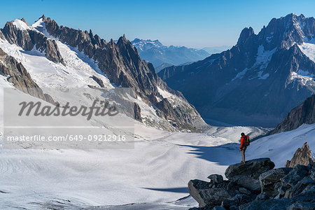Hiker enjoying scenery, Chamonix-Mont-Blanc, Rhone-Alpes, France Hiker enjoying scenery, Chamonix-Mont-Blanc, Rhone-Alpes, France