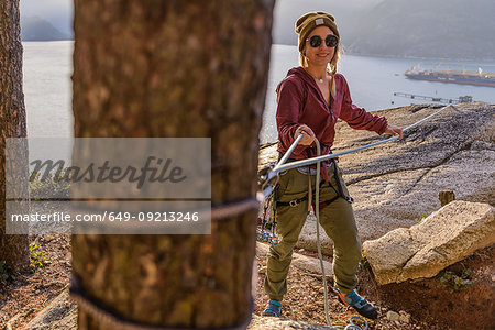 Rock climber using safety harness ropes, Malamute, Squamish, Canada