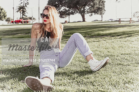 Hip young woman relaxing in park