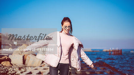 Stylish mid adult woman balancing on beach, Odessa, Odeska Oblast, Ukraine