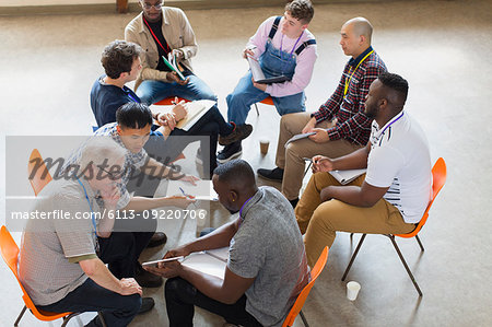 Men talking in group therapy
