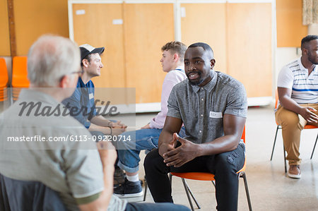 men talking in community center