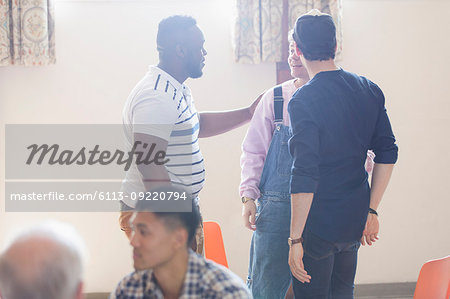 Men talking in group therapy