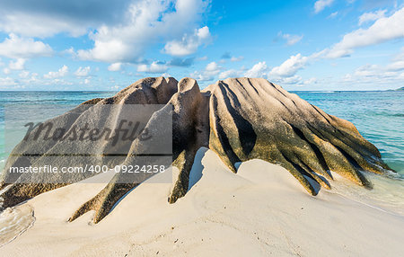 Beautifully shaped granite boulder in the sea shot in long exposure at Anse Source d'Argent beach, La Digue island, Seychelles