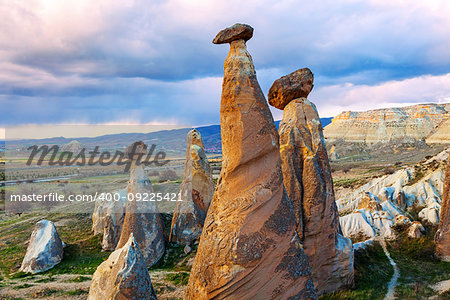 Cylindrical stone cliffs and cave houses near Goreme, Turkey